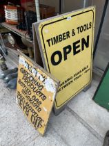 A 'TIMBER AND TOOLS' WOODEN A BOARD SIGN AND A FURTHER WOODEN SIGN