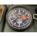 A DEALERS WALL CLOCK, BELIEVED WORKING