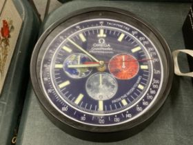 A DEALERS WALL CLOCK, BELIEVED WORKING