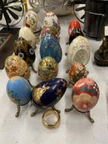 A COLLECTION OF PAINTED AND ENAMELLED EGGS - 15 IN TOTAL