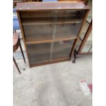 A MID 20TH CENTURY HERBERT GIBBS BOOKCASE WITH FOUR SLIDING GLASS DOORS, 36" WIDE
