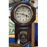A WOODEN CASED TOKYO CLOCK CO REGULATOR WALL CLOCK WITH PENDULUM AND KEY