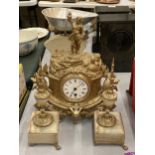 A FRENCH STYLE GILT EFFECT ORNATE MANTLE CLOCK AND ONYX GARNITURE SET WITH FIGURAL TOP