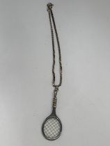 A SILVER TENNIS RACKET BRACELET