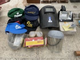 AN ASSORTMENT OF ITEMS TO INCLUDE A WELDING MASK, GOGGLES AND BASEBALL CAPS ETC