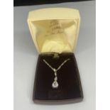 A BOXED SILVER AND CRYSTAL NECKLACE