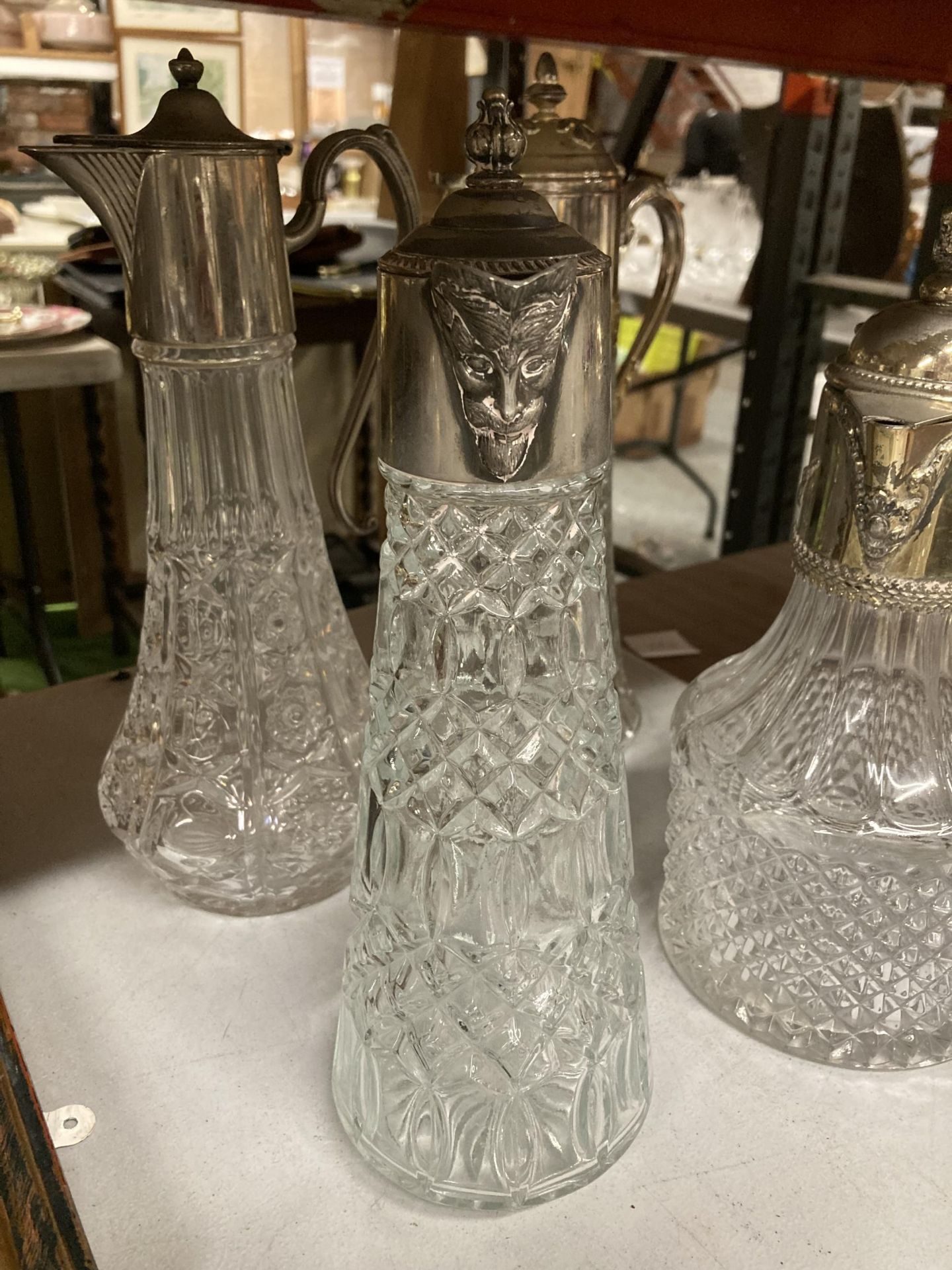 A GROUP OF FOUR SILVER PLATED AND CUT GLASS CLARET JUGS AND TWO FURTHER DECANTERS - Image 2 of 5