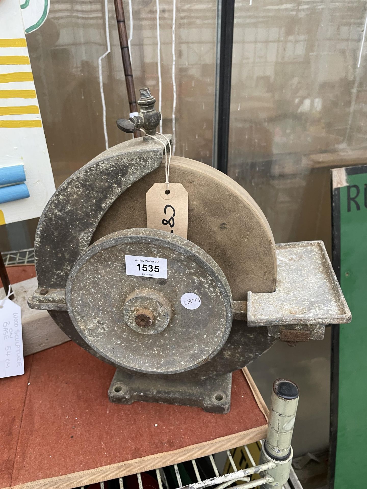 A VINTAGE WORKBENCH GRIND STONE WITH PULLEY WHEEL