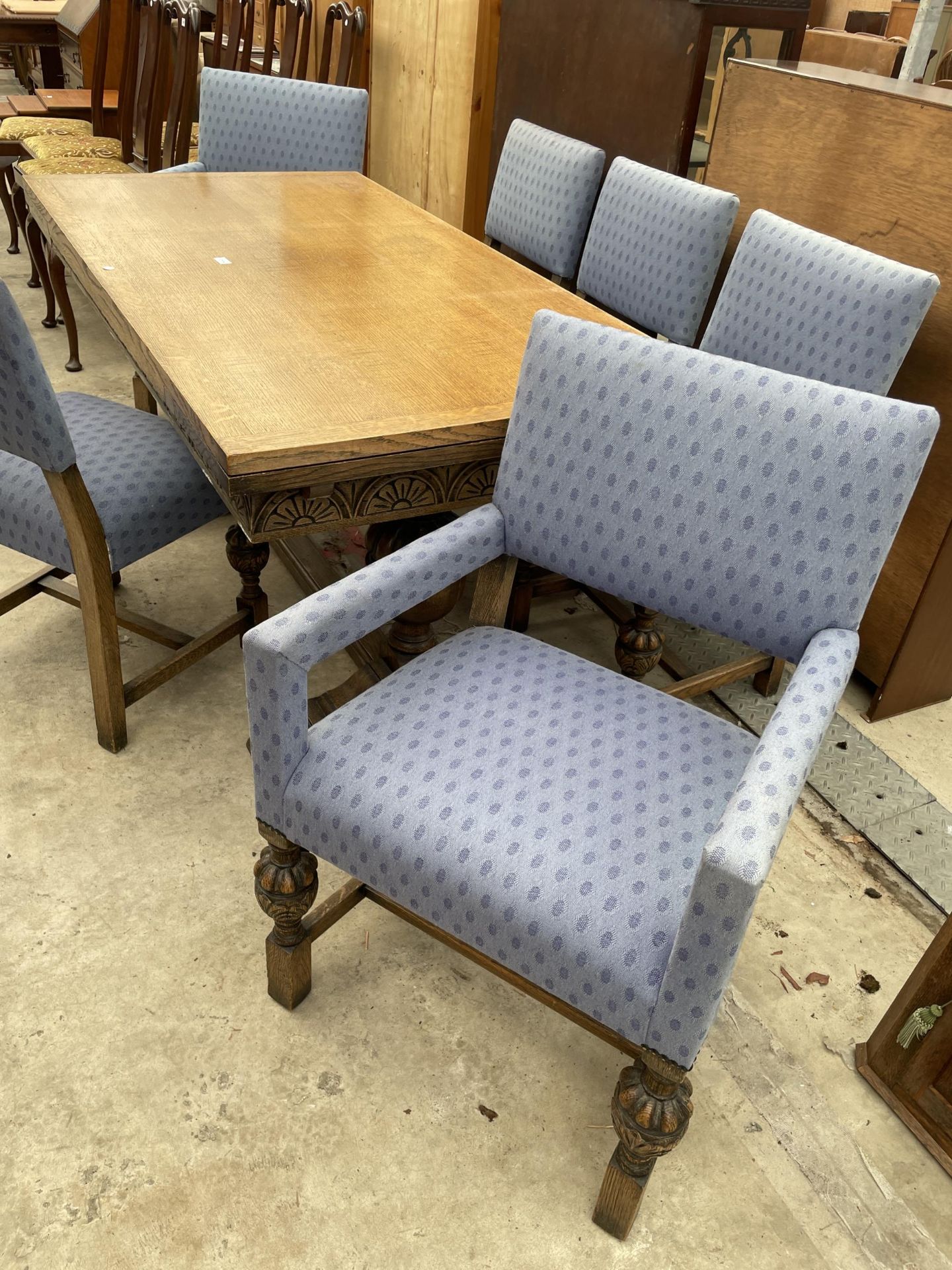 AN EARLY 20TH CENTURY OAK TWIN-PEDESTAL DRAW-LEAF DINING TABLE AND SIX CHAIRS, TWO BEING CARVERS, 60 - Image 6 of 9