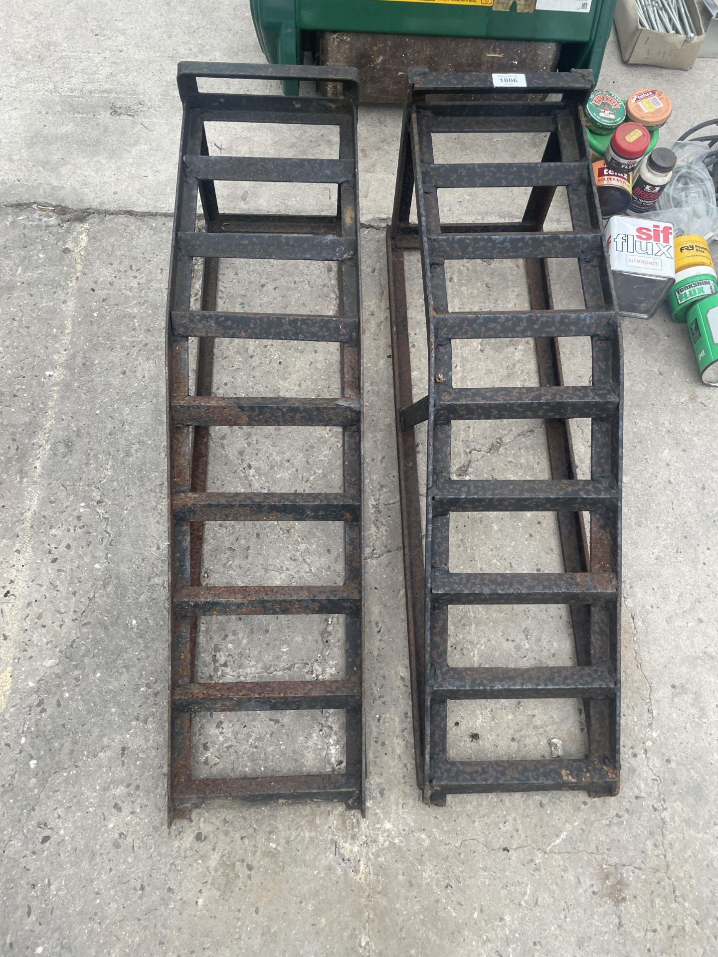 A PAIR OF METAL CAR RAMPS