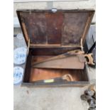 A VINTAGE METAL TOOL CHEST AND THREE VINTAGE SAWS