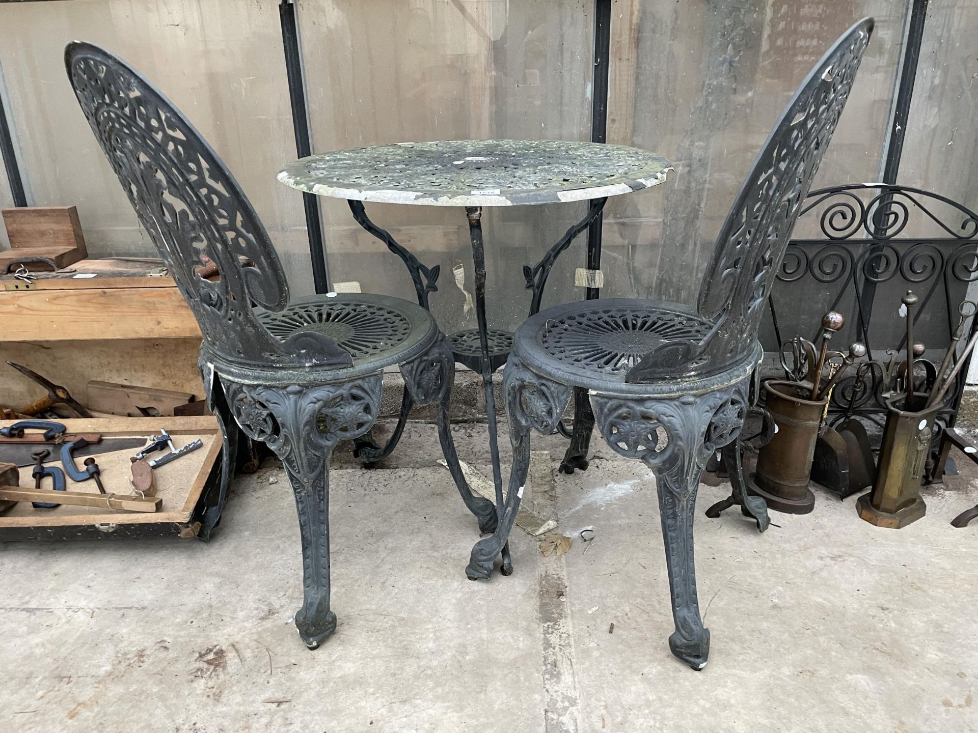 A CAST ALLOY BISTRO SET COMPRISING OF A ROUND TABLE AND TWO CHAIRS - Image 2 of 2