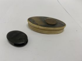 A SMALL OVAL BONE TRINKET BOX AND A BONE MAGNIFYING GLASS