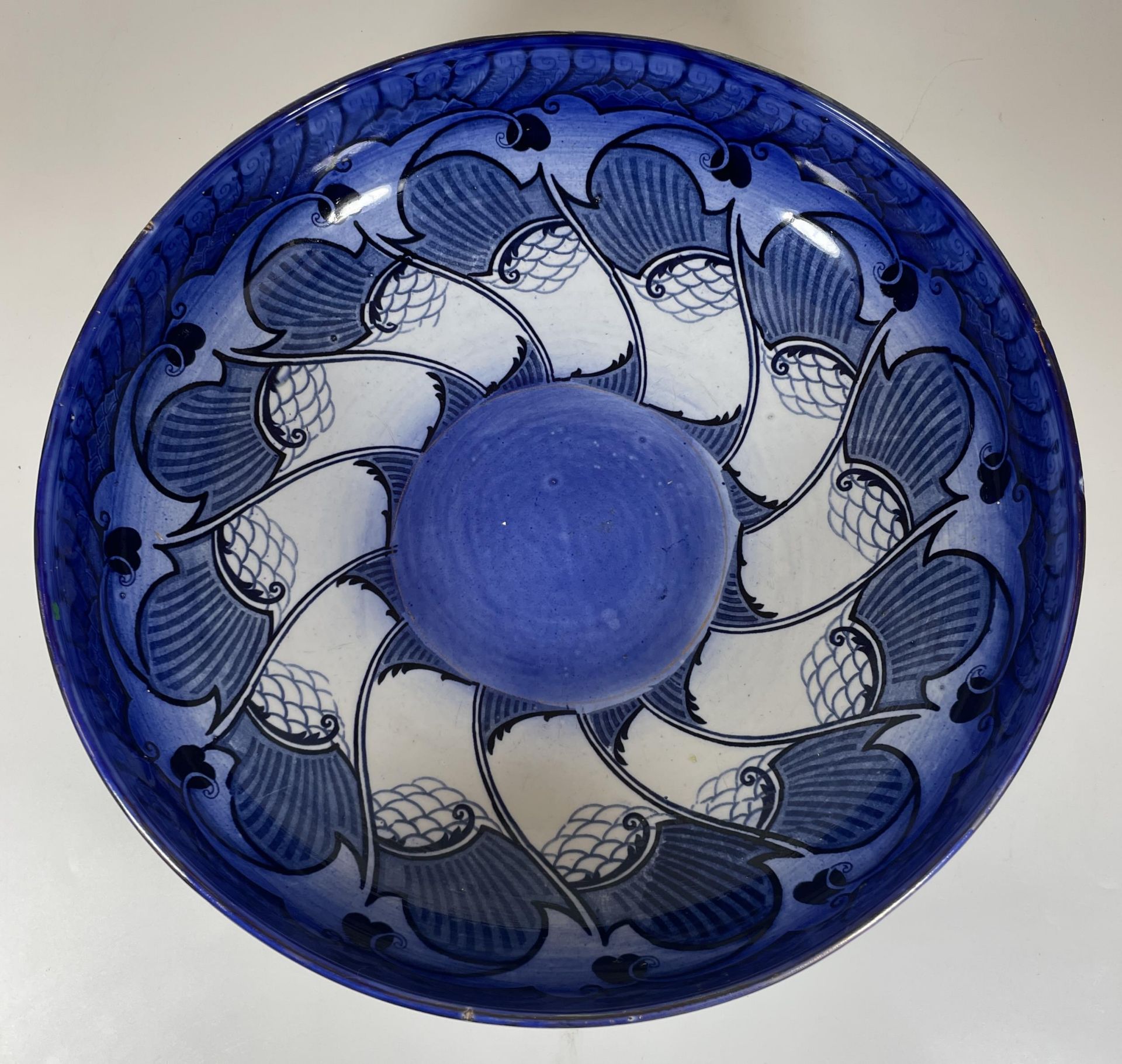 A LARGE ART NOUVEAU ROYAL DOULTON BLUE AND WHITE GEOMETRIC FRUIT BOWL WITH ARTISTS MONOGRAM TO BASE
