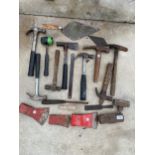 AN ASSORTMENT OF HAND TOOLS TO INCLUDE HAMMERS, TROWELS AND THREE AXE HEADS ETC