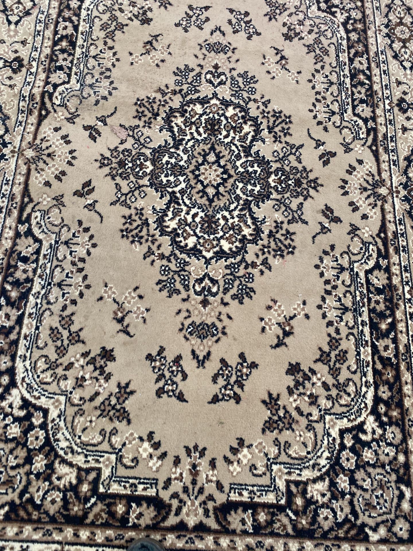 A CREAM PATTERNED RUG - Image 2 of 2