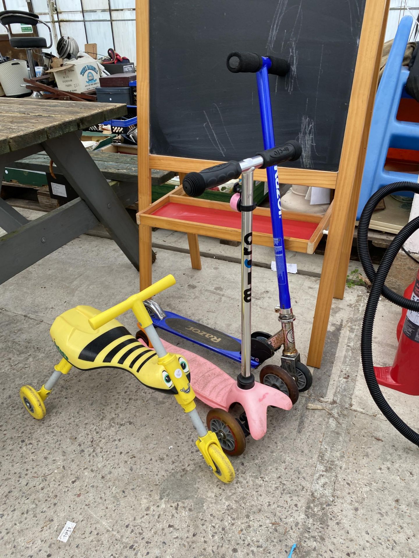 TWO SCOOTERS, A PUSH ALONG TRIKE AND A BLACK BOARD - Image 2 of 2