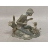 A NAO LLADRO FIGURE OF A BOY WITH DOG