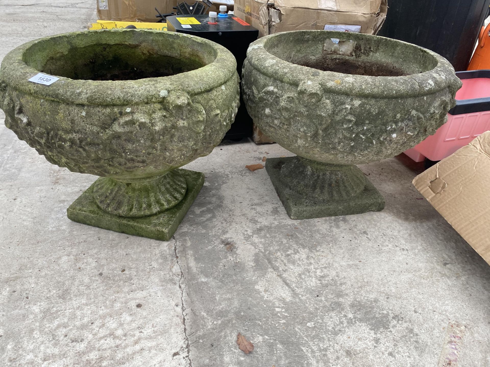 A PAIR OF RECONSTITUTED STONE CIRCULAR BOWL PLANTERS WITH PEDESTAL BASES