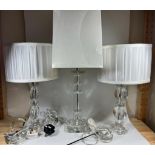 A GROUP OF THREE MODERN GLASS TABLE LAMPS AND SHADES