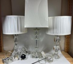A GROUP OF THREE MODERN GLASS TABLE LAMPS AND SHADES