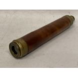 A VINTAGE BRASS AND WOODEN THREE SECTION TELESCOPE