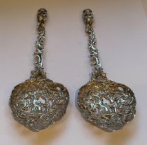 A PAIR OF HALLMARKED BIRMINGHAM SILVER PIERCED DESIGN SPOONS, MARKS INDISTINCT, GROSS WEIGHT 98