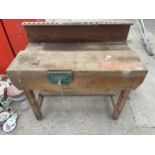 A CHILDS WOODEN WORK BENCH WITH WOOD VICE