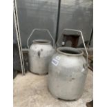 A PAIR OF STAINLESS STEEL MILKING BUCKETS