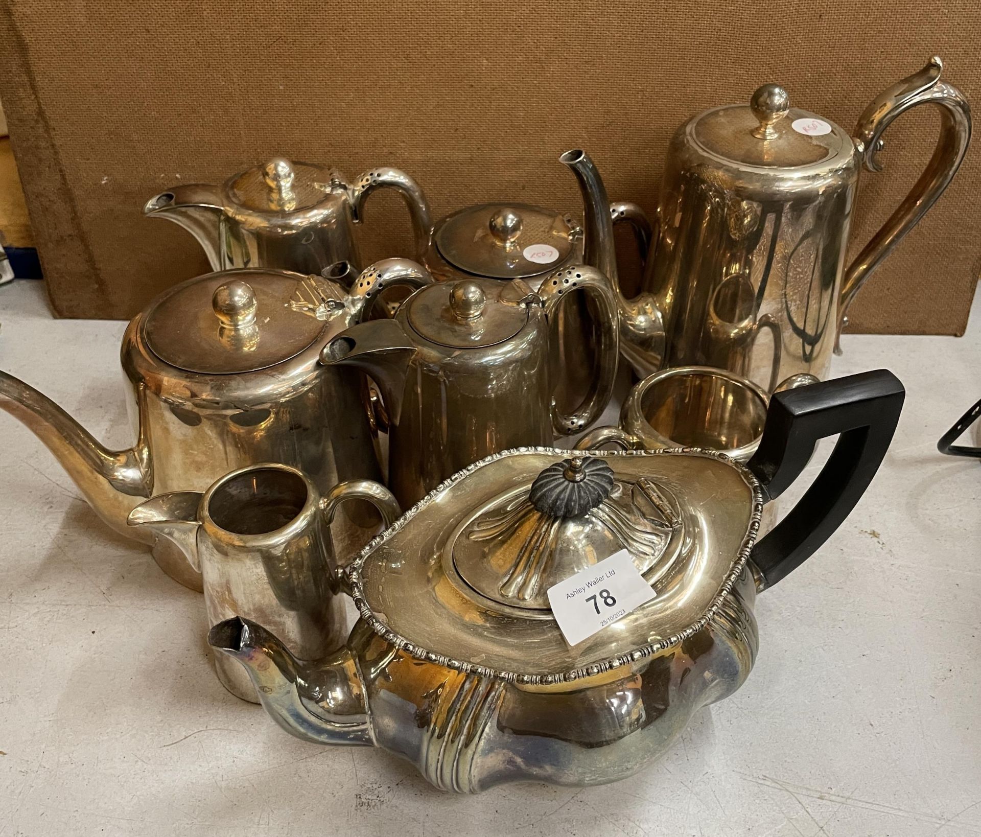 A COLLECTION OF SILVER PLATED TEA AND COFFEE POTS TO INCLUDE SIX WALKER AND HALL & AN ELKINGTON