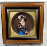 A 19TH CENTURY FRAMED HAND PAINTED PORCELAIN PLAQUE DEPICTING A LADY WITH A FEATHERED HAT, 27 X 26CM