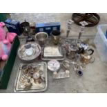 A LARGE ASSORTMENT OF SILVER PLATED ITEMS TO INCLUDE A TROPHY, CANDLESTICKS, TEAPOTS AND TRAYS ETC