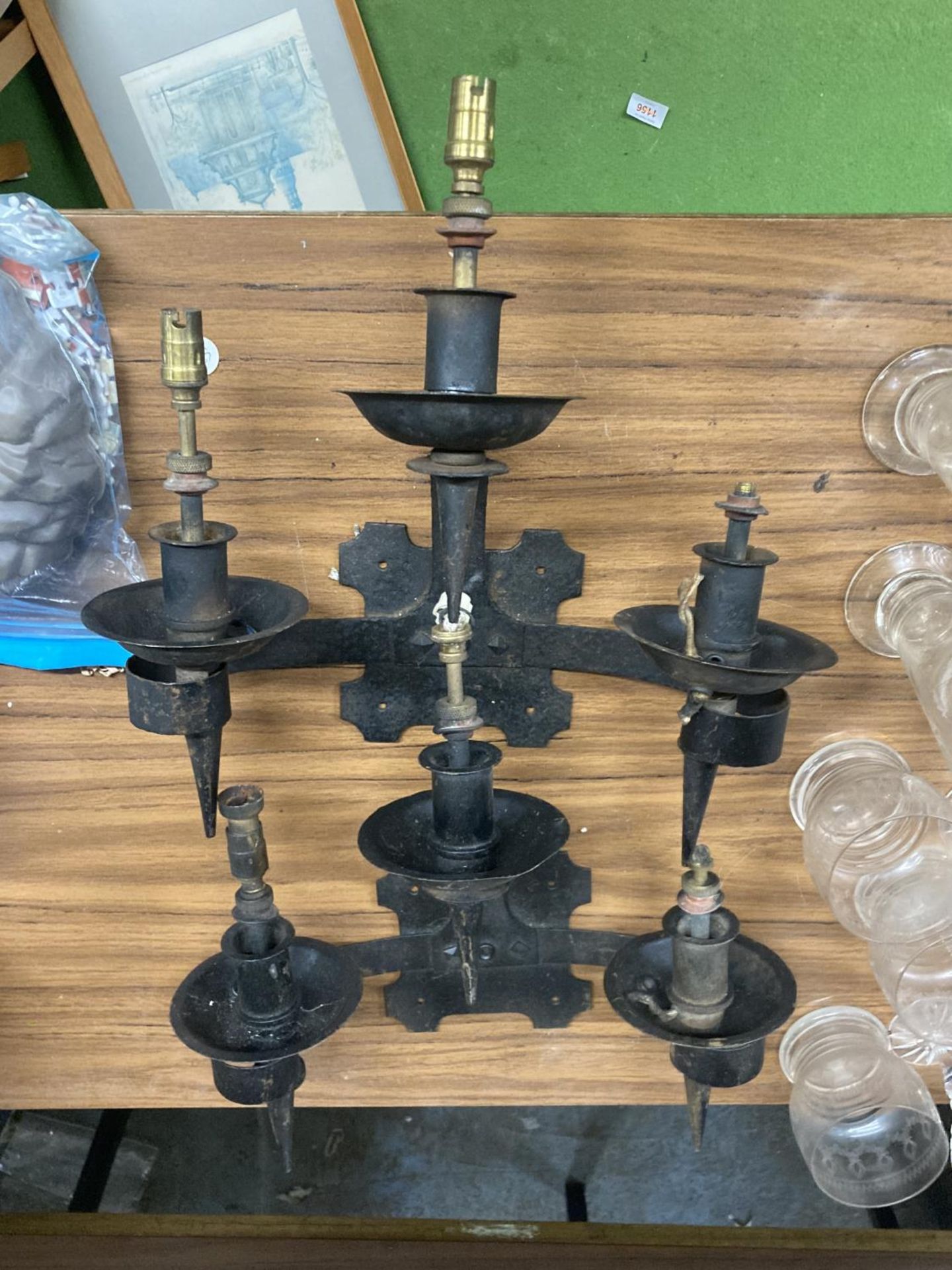 TWO WROUGHT IRON THREE ARMED CANDLEABRA LIGHT FITTINGS