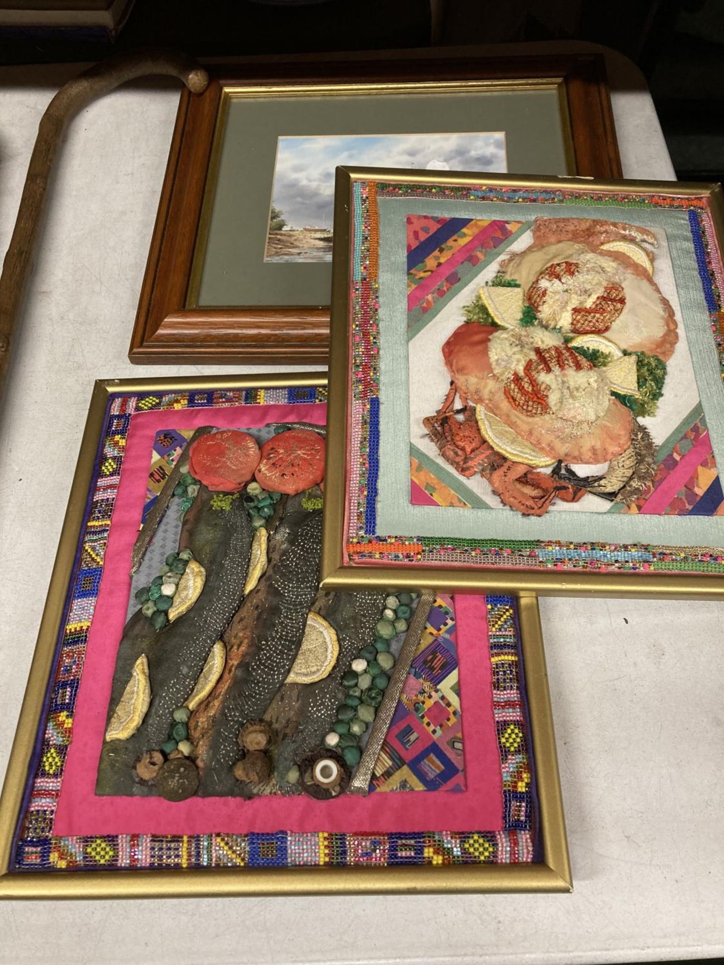 THREE FRAMED PICTURES - TWO PAPIER MACHE FOOD EXAMPLES AND A PRINT OF A CASTLE