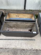 A PAIR OF LOW FIBRE GLASS TROUGH PLANTERS (L:50CM)