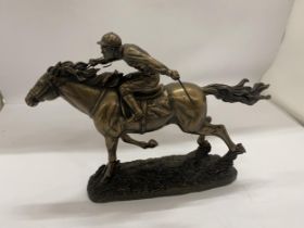 A RESIN FIGURE OF A RACEHORSE AND JOCKEY, HEIGHT 21CM, LENGTH 30CM