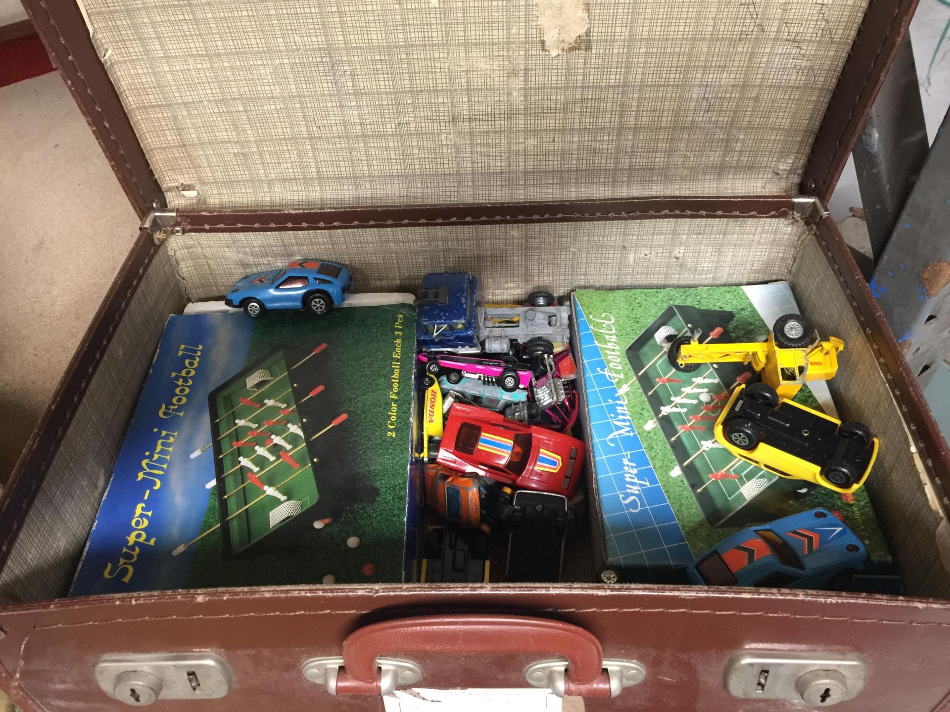 A VINTAGE SUITCASE OF ASSORTED VEHICLES, MINI FOOTBALL GAMES ETC - Image 2 of 2