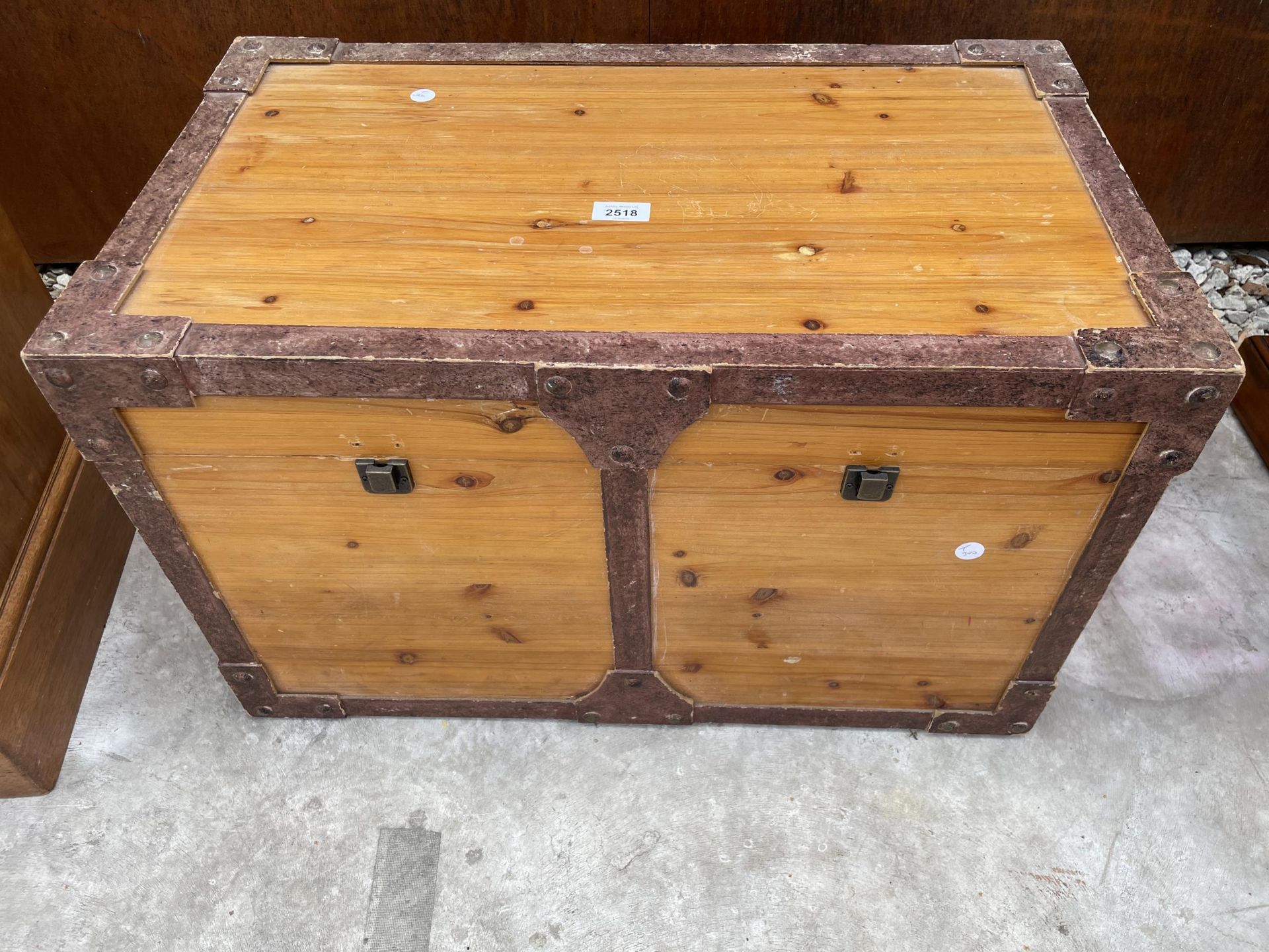 A PINE TUCK BOX WITH METALWARE EFFECT FRAME