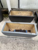 A PAIR OF LOW FIBRE GLASS TROUGH PLANTERS (L:50CM)