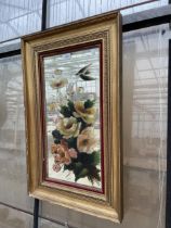 A GILT FRAMED PAINTED WALL MIRROR WITH FLORAL DECORATION