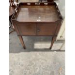 A GEORGIAN STYLE MAHOGANY NIGHT TABLE WITH PIERCED GALLERY AND TWO DOORS, ON TAPERED LEGS, WITH