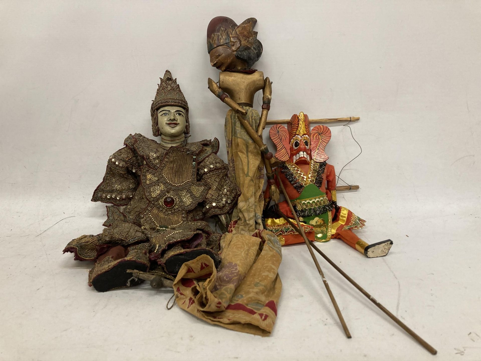 A GROUP OF VINTAGE ORIENTAL DESIGN HAND PAINTED PUPPETS