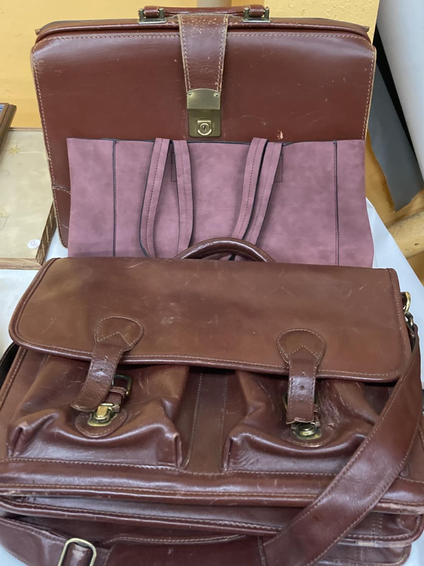 TWO VINTAGE LEATHER BRIEFCASES, ONE BEING ASHWOOD, PLUS A SUEDE SHOPPER