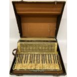 A VINTAGE CASED MOZART ACCORDION WITH INLAID DESIGN