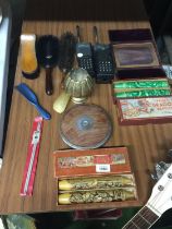 A MIXED LOT TO INCLUDE ORIENTAL PATTERNED WAX CANDLES, A VINTAGE DISCUS, BRUSHES, WALKIE TALKIES,