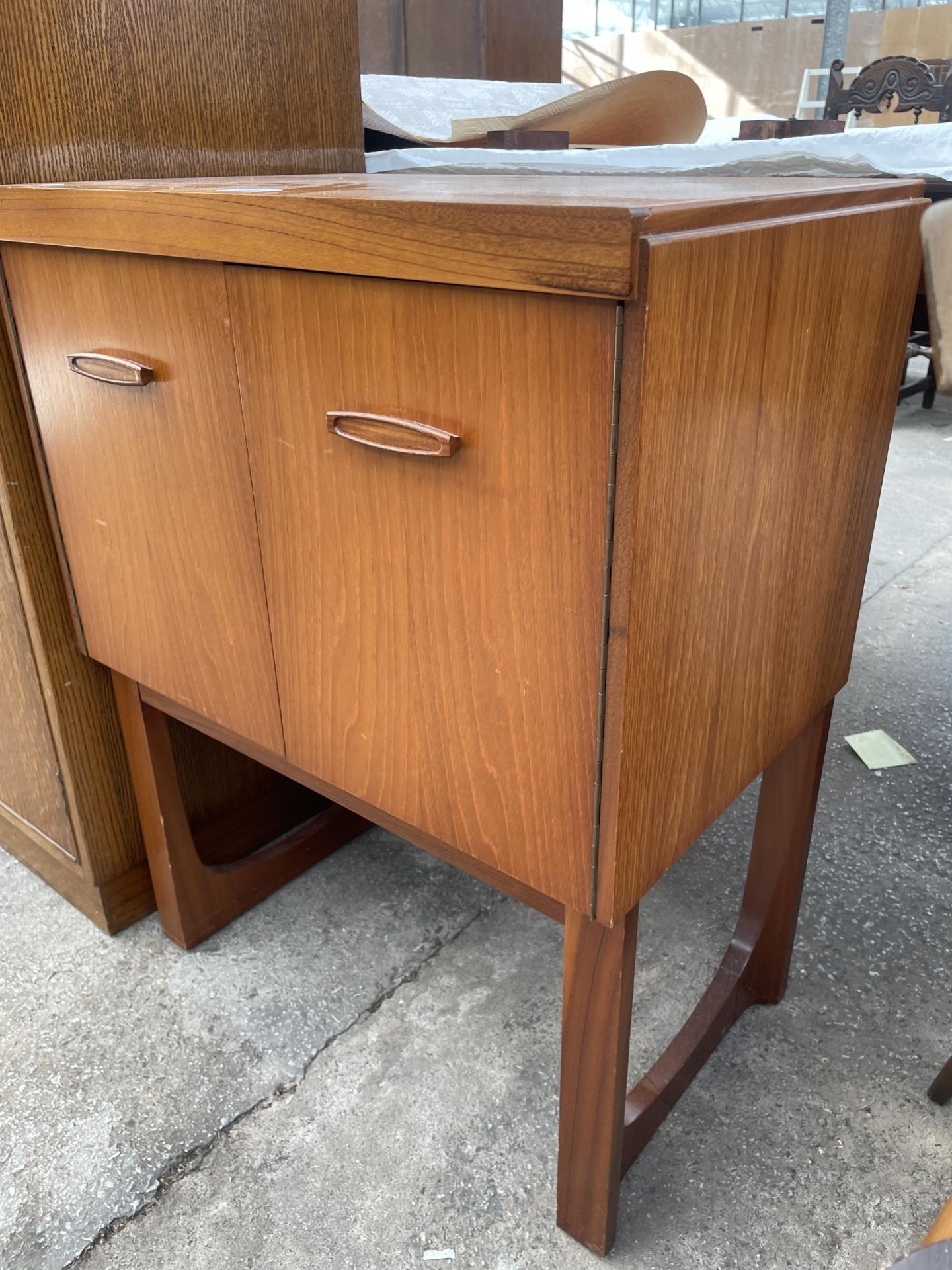 A RETRO TEAK REMPLOY TWO DOOR CABINET ON OPEN BASE, 23.5" WIDE - Image 2 of 4