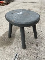 A VINTAGE PAINTED PINE FOUR LEGGED MILKING STOOL