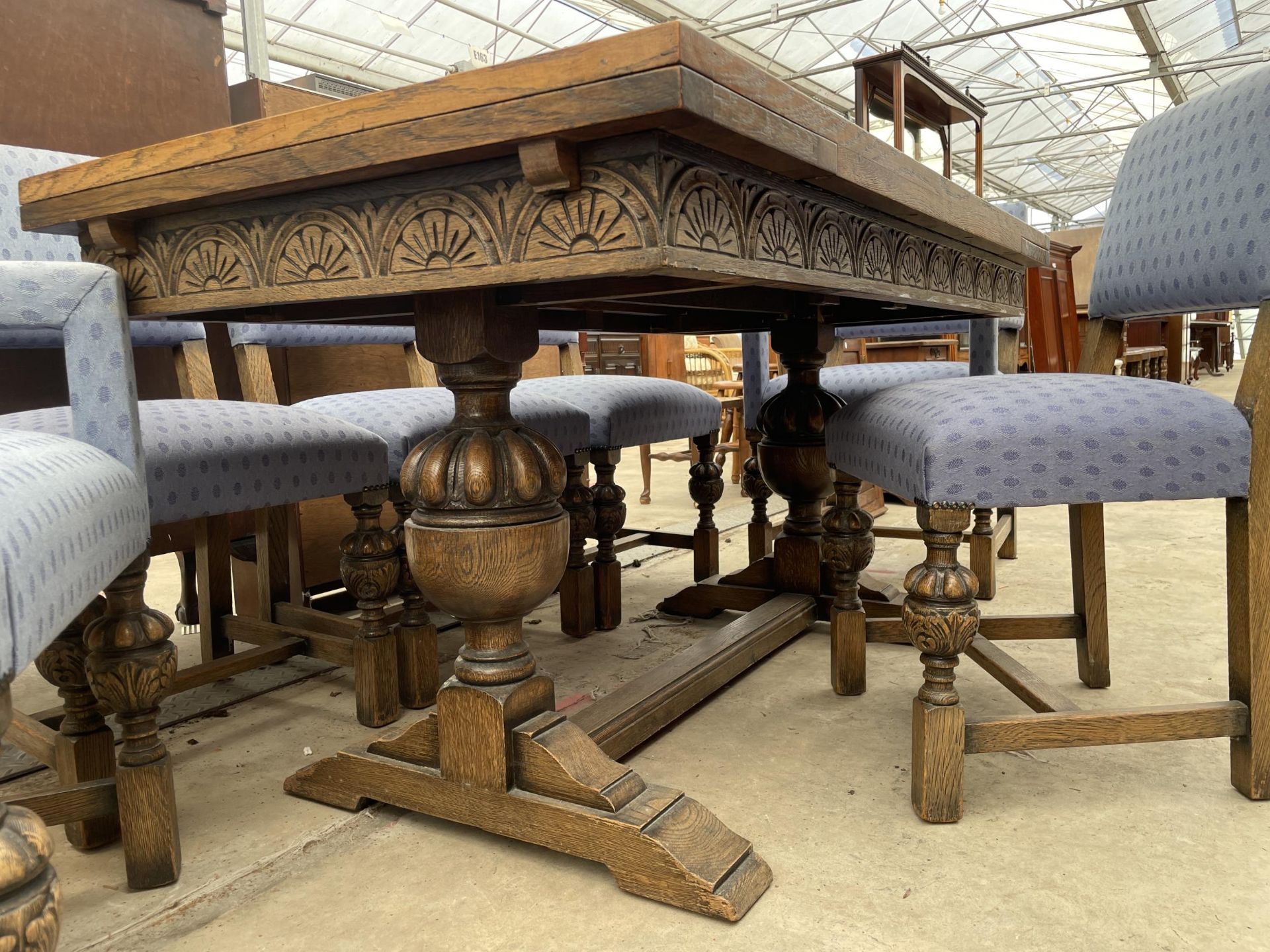 AN EARLY 20TH CENTURY OAK TWIN-PEDESTAL DRAW-LEAF DINING TABLE AND SIX CHAIRS, TWO BEING CARVERS, 60 - Image 4 of 9