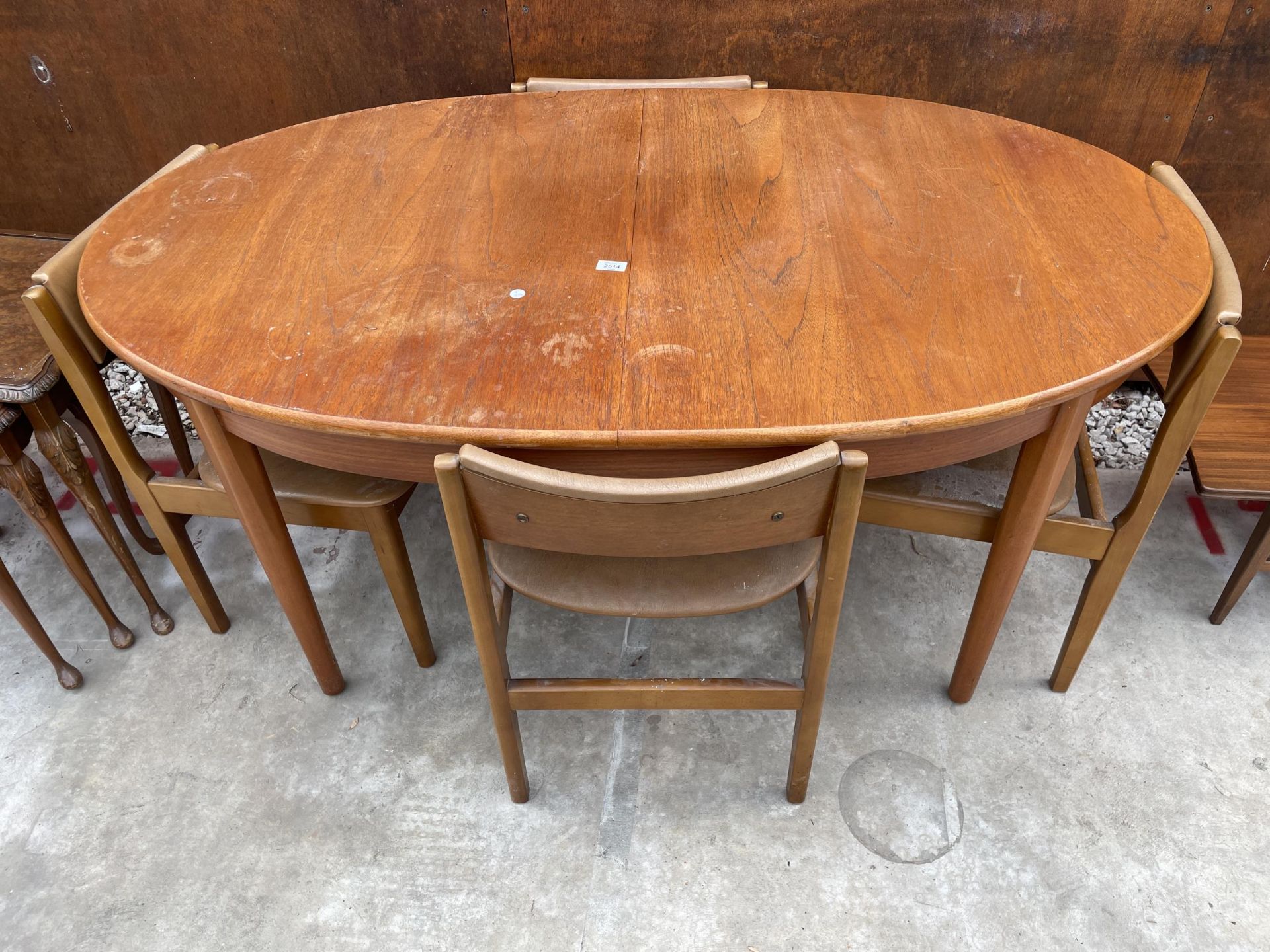 AN OVAL RETRO TEAK EXTENDING DINING TABLE, 60 X 36" (LEAF 18") AND FOUR CHAIRS
