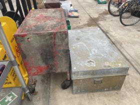 A LARGE GALVANISED STORAGE TRUNK AND A FOUR WHEELED WORKSHOP TROLLEY